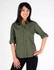 A woman models an olive green women's military long sleeve button-up shirt with rolled sleeves and two chest pockets.