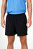 Black men's FLEX shorts with a four-way stretch design, showcased on a model wearing a blue top.