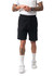 Men's cotton dress shorts in black, featuring an elastic waistband and zippered pockets, with a model standing.