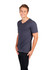 A men's unisex raw cotton v-neck t-shirt in dark grey, featuring a logo. Model shown wearing it.