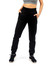 Brushed fleece track pants for women in black with side pockets, featured with a casual top and black sneakers.