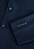 A navy blue jacket featuring a sleek design and buttoned cuffs, with a subtle logo present.
