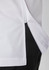A close-up view of a white and black jacket, featuring a zip and side seam detail. The jacket has a logo.