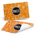 A full colour orange place mat featuring fruit illustrations, with a logo prominently displayed in the centre.