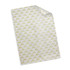 A sheet of white tissue paper featuring a patterned design in gold. The paper has a slight sheen and a folded corner.
