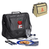 A black picnic bag with cutlery, a plate of food, and a drink glass. A beige bag with a logo is also visible.