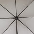 An open umbrella viewed from underneath, featuring a black rib structure and a white canopy.