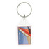 A clear tear drop acrylic keychain with a circular metal ring and a branding design featuring red and white colours.