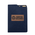 A navy notebook with a textured cover and a brown leather logo patch. It has a folder-style design.