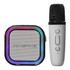 A portable karaoke machine in black and white, featuring a speaker with a multicoloured edge and a handheld microphone.