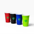 A set of four plastic party cups in red, black, blue, and green, each featuring a logo.