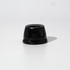 A black speaker with a rounded design, featuring a smooth surface and a small branding element at the front.