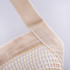 A beige mesh tote bag with sturdy fabric straps, featuring a textured woven design and a simple logo.
