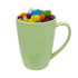 A light green bamboo mug filled with assorted colourful jelly beans and featuring a handle.