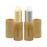 Two bamboo lip balm sticks in natural wooden casings, one with a creamy gold colour and the other a smooth white.