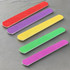 A set of five nail files in red, purple, yellow, green, and pink on a textured surface. Each file has a plain design.