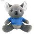 A grey koala plush toy wearing a blue shirt, featuring soft ears and a cute face, with a branding logo visible.
