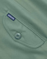 Lambretta Mens Showerproof Classic Harrington MOD Scooter Jacket Coat, close-up of the jacket's pocket with Lambretta branded button and tag.