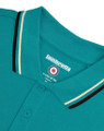 Lambretta Mens Casual Classic Twin Tipped MOD SKA Polo Shirt, close-up of the turquoise polo shirt's collar with black and cream twin tips and buttons.