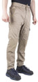Caterpillar Dynamic Men Cargo Slim-Fit Stretch Work Trousers - 30/32", beige cargo pants with multiple pockets and slim fit design, paired with black athletic shoes.
