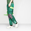 Birkenstock A640 Mens Steel Toe SB Work Kitchen Cloggs Shoes, white slip-on clogs with steel toe protection worn by a person dressed in green work pants and a green shirt, holding a green watering can.