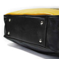 Lambretta Classic Retro Messenger Shoulder Laptop Tablet Body Strap Bag, close-up view of the bottom with metal studs and black leather-like material.