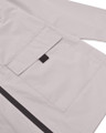 Lambretta Mens Casual Hooded Lightweight MOD SKA Parka Coat, close-up of the light grey fabric showing the large front pocket and black zipper.