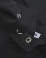 Lambretta Mens Shower Resistant Hooded Classic Badge Fishtail Parka, close-up of metal snap buttons on black waterproof jacket.