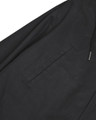 Lambretta Mens Shower Resistant Hooded Classic Badge Fishtail Parka, close-up of the black waterproof jacket with a zipper pocket detail.