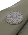 Lambretta Riley Mens Hooded Lightweight MOD SKA Coat Jacket, close-up of the jacket's logo badge on the front in beige fabric.