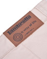 Lambretta Mens Chino Casual Classic Shorts, close-up of the leather brand label on light-colored fabric.