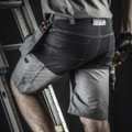 Scruffs Trade Flex Mens Pockets Cargo Shorts, close-up of men's black and gray cargo shorts with multiple pockets, contrast stitching, and a relaxed fit for work or casual wear.