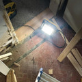 Defender 20W 30W 50W Slimline LED Floor Light Wired Floodlight, bright LED floodlight illuminating a construction site floor.