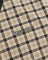 Lambretta Mens Check Classic Mod Ska Casual Smart Polo, close-up of beige and black plaid fabric with Lambretta logo.