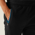 Regatta Jeopardize Mens Work Trade Comfort Joggers, close-up of black joggers with a blue zipper pocket on the side and an elastic waistband.