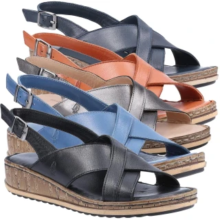 Hush Puppies Elena Womens Crossover Casual Strap Buckle Sandals, display of four pairs in black, blue, beige, and orange with cork wedge heels and cross-over straps with buckle closures.