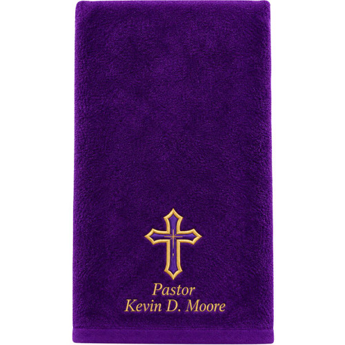 A rich purple pastor towel featuring a beautifully embroidered gold cross with a subtle purple accent at the center. The towel’s plush texture and high‑quality stitching create a polished, elegant look ideal for worship services, clergy use, pastor appreciation gifts, and special church occasions. The embroidery stands out boldly against the deep purple fabric, highlighting the craftsmanship and spiritual symbolism of the design.