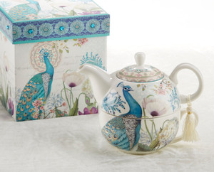 Peacock Tea for one set in gift box, will brighten anyone's day with this beautiful tea for one gift set in its own matching print gift box with matching satin ribbon. A decorative tassel on the handle adds a lovely touch. Gifting Idea: birthday gift, bridal shower, get well, thank you or treat yourself. Holds enough for a refill without leaving your comfy spot, desk or sip at beside for an evening nightcap. Includes: 5.8" Tea for One Set in gift box Stacked teapot and oversized teacup Soft white background in hughes of royal blue and teal Peacock print Dishwasher safe Other Items Available: Tea choices available to add to your order in the loose-leaf shop Teas and Teaware are shipped together, Cornucopia Teas come in resealable pouches with decorative tea labels, and includes a brewing guide. If purchasing as a gift your personal message is included on the gift card Peacock Tea for one set in gift box, will brighten anyone's day with this beautiful tea for one gift set in its own matching print gift box with matching satin ribbon. A decorative tassel on the handle adds a lovely touch. Gifting Idea: birthday gift, bridal shower, get well, thank you or treat yourself. Holds enough for a refill without leaving your comfy spot, desk or sip at beside for an evening nightcap. Includes: 5.8" Tea for One Set in gift box Stacked teapot and oversized teacup Soft white background in hughes of royal blue and teal Peacock print Dishwasher safe Other Items Available: Tea choices available to add to your order in the loose-leaf shop Teas and Teaware are shipped together, Cornucopia Teas come in resealable pouches with decorative tea labels, and includes a brewing guide. If purchasing as a gift your personal message is included on the gift card