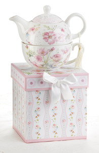 Poppyseed Tea for one set in gift box, will brighten anyone's day with this beautiful tea for one gift set in its own matching print gift box with matching satin ribbon. A decorative tassel on the handle adds a lovely touch. Gifting Idea: birthday gift, bridal shower, get well, thank you or treat yourself. Holds enough for a refill without leaving your comfy spot, desk or sip at beside for an evening nightcap. Includes: 5.8" Tea for One Set in gift box Stacked teapot and oversized teacup Soft white background with a pink foral print Dishwasher safe Other Items Available: Tea choices available to add to your order in the loose-leaf shop Teas and Teaware are shipped together, Cornucopia Teas come in resealable pouches with decorative tea labels, and includes a brewing guide. If purchasing as a gift your personal message is included on the gift card Poppyseed Tea for one set in gift box, will brighten anyone's day with this beautiful tea for one gift set in its own matching print gift box with matching satin ribbon. A decorative tassel on the handle adds a lovely touch. Gifting Idea: birthday gift, bridal shower, get well, thank you or treat yourself. Holds enough for a refill without leaving your comfy spot, desk or sip at beside for an evening nightcap. Includes: 5.8" Tea for One Set in gift box Stacked teapot and oversized teacup Soft white background with a pink foral print Dishwasher safe Other Items Available: Tea choices available to add to your order in the loose-leaf shop Teas and Teaware are shipped together, Cornucopia Teas come in resealable pouches with decorative tea labels, and includes a brewing guide. If purchasing as a gift your personal message is included on the gift card