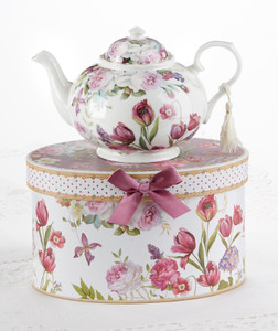 Tulip Teapot in gift box, will brighten anyone's day with this beautiful teapot gift in its own matching print gift box with matching satin ribbon. A decorative tassel on the handle adds a lovely finishing touch. Gifting Idea: birthday gift, bridal shower, get well, treat yourself or someone you love. Includes: 9.5 x 5.6" porcelain teapot Soft white background with a purple tulip floral print Dishwasher safe Other Items Available: Tea choices available to add to your order in the loose-leaf shop Teas and Teaware are shipped together, Cornucopia Teas come in resealable pouches with decorative tea labels, and includes a brewing guide. If purchasing as a gift your personal message is included on the pamphlet. Tulip Teapot in gift box, will brighten anyone's day with this beautiful teapot gift in its own matching print gift box with matching satin ribbon. A decorative tassel on the handle adds a lovely finishing touch. Gifting Idea: birthday gift, bridal shower, get well, treat yourself or someone you love. Includes: 9.5 x 5.6" porcelain teapot Soft white background with a purple tulip floral print Dishwasher safe Other Items Available: Tea choices available to add to your order in the loose-leaf shop Teas and Teaware are shipped together, Cornucopia Teas come in resealable pouches with decorative tea labels, and includes a brewing guide. If purchasing as a gift your personal message is included on the pamphlet.