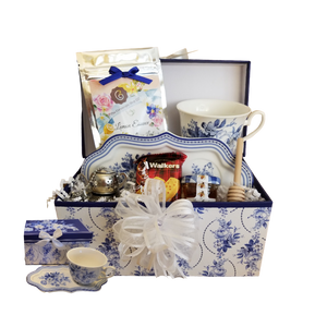 Pamper Me Gift Box - Tea n Toast: A pleasant way to create a moment of indulgence. Sip on Cornucopia's specialty loose leaf tea and cuddle up with a good book, sounds inviting to whisk your cares away. Meant for everyday use. Comes in its own matching print gift box with matching satin ribbon. Great Gift Idea: New Mommy, Birthday, Get Well, Thank you, or Bridal gift. Gift Set Includes: • 4.2" x 9” tray, Porcelain Teacup: Choose from the pattern choices, each gift set comes with its own coordinate tea flavor, • 1 oz of Loose-Leaf Cornucopia Tea • Shortbread Cookies • 1 oz Bonne Maman honey, • Wood Honey Spool • Tea Ball (tea kettle) stainless steel Tea filter by Cha Cult (Germany) Complimentary gift card included with your personal message. Each gift is shrink wrapped in its matching China pattern gift box, and coordinated gift bow. Pamper Me Gift Box - Tea n Toast: A pleasant way to create a moment of indulgence. Sip on Cornucopia's specialty loose leaf tea and cuddle up with a good book, sounds inviting to whisk your cares away. Meant for everyday use. Comes in its own matching print gift box with matching satin ribbon. Great Gift Idea: New Mommy, Birthday, Get Well, Thank you, or Bridal gift. Gift Set Includes: • 4.2" x 9” tray, Porcelain Teacup: Choose from the pattern choices, each gift set comes with its own coordinate tea flavor, • 1 oz of Loose-Leaf Cornucopia Tea • Shortbread Cookies • 1 oz Bonne Maman honey, • Wood Honey Spool • Tea Ball (tea kettle) stainless steel Tea filter by Cha Cult (Germany) Complimentary gift card included with your personal message. Each gift is shrink wrapped in its matching China pattern gift box, and coordinated gift bow.