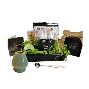 Macho Matcha Man for Father's Day: This gift is perfect for health-conscious Dad. Comes with two varieties of loose-leaf teas. Detox tea, and Green Tea Matcha powder, and everything required to master making Matcha tea, including a recipe guide. Includes: • 1 oz of Cornucopia's Matcha Green Tea Powder: an organic culinary-grade green tea powder. Carries a creamy, non-bitter, vegetal flavor profile. Unlike regular green tea, where the leaves are removed after being brewed, Matcha Green Powder is stone ground into a fine powder (from the leaves) and meant to be whisked with water and consumed entirely, hence ensuring almost 10-times higher concentration of antioxidants, polyphenols, vitamins, and minerals. This culinary-grade Matcha Green Powder is meant for making smoothies, shakes, lattes, cocktails, and cooking, and is the grade of matcha that you would commonly drink in coffee shops or cafés. • 1 oz of Cornucopia's organic Ayurvedic Infusions Detox Loose Leaf Tea: aims to establish a balance of immunity, inner peace and physical rejuvenation, allowing one's prakriti to heal and start anew.* Ingredients: Organic lemongrass leaf, organic echinacea purpurea herb, organic licorice root, organic dandelion root, organic peppermint leaf, organic Tulsi leaf and organic ginger root. • Zen Matcha Bowl (Kimi), • Matcha Whisk (Chasen), • Matcha Bamboo Spoon (Momoka), • Porcelain Matcha Whisk Holder (Ingolf), • Matcha Measuring Spoon engraved with " 1 Cup of Perfect Matcha." This gift comes wrapped in cellophane and topped with a handmade bow. A complimentary Father's Day Card with your personal message. *Information on Ayurvedic Infusions (Wellness) Loose Leaf Tea guide included. Macho Matcha Man for Father's Day: This gift is perfect for health-conscious Dad. Comes with two varieties of loose-leaf teas. Detox tea, and Green Tea Matcha powder, and everything required to master making Matcha tea, including a recipe guide. Includes: • 1 oz of Cornucopia's Matcha Green Tea Powder: an organic culinary-grade green tea powder. Carries a creamy, non-bitter, vegetal flavor profile. Unlike regular green tea, where the leaves are removed after being brewed, Matcha Green Powder is stone ground into a fine powder (from the leaves) and meant to be whisked with water and consumed entirely, hence ensuring almost 10-times higher concentration of antioxidants, polyphenols, vitamins, and minerals. This culinary-grade Matcha Green Powder is meant for making smoothies, shakes, lattes, cocktails, and cooking, and is the grade of matcha that you would commonly drink in coffee shops or cafés. • 1 oz of Cornucopia's organic Ayurvedic Infusions Detox Loose Leaf Tea: aims to establish a balance of immunity, inner peace and physical rejuvenation, allowing one's prakriti to heal and start anew.* Ingredients: Organic lemongrass leaf, organic echinacea purpurea herb, organic licorice root, organic dandelion root, organic peppermint leaf, organic Tulsi leaf and organic ginger root. • Zen Matcha Bowl (Kimi), • Matcha Whisk (Chasen), • Matcha Bamboo Spoon (Momoka), • Porcelain Matcha Whisk Holder (Ingolf), • Matcha Measuring Spoon engraved with " 1 Cup of Perfect Matcha." This gift comes wrapped in cellophane and topped with a handmade bow. A complimentary Father's Day Card with your personal message. *Information on Ayurvedic Infusions (Wellness) Loose Leaf Tea guide included.