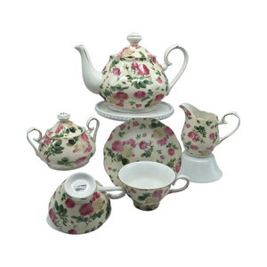 Grace Teaware Rose Chintz Bouquet Tea Set 11pc porcelain Grace Tea set in a Rose chintz with yellow background and white with gold trim. Beautiful and easy to incorporate into any table decor. Complete service for 4. Teapot holds 5 cups. Matching cream and sugar bowl. To be enjoyed for years to come. Gifting Idea: birthday, bridal shower, or Mother's Day. treat yourself or someone you love! Includes: 11 pc porcelain tea set by Grace Teaware 1- 5 cup Teapot 4 - cup/saucer set 1 - Cream/sugar set White background with rose chintz print on a pale yellow background, gold trims Dishwasher safe Enclosure card included. Grace Teaware Rose Chintz Bouquet Tea Set 11pc porcelain Grace Tea set in a Rose chintz with yellow background and white with gold trim. Beautiful and easy to incorporate into any table decor. Complete service for 4. Teapot holds 5 cups. Matching cream and sugar bowl. To be enjoyed for years to come. Gifting Idea: birthday, bridal shower, or Mother's Day. treat yourself or someone you love! Includes: 11 pc porcelain tea set by Grace Teaware 1- 5 cup Teapot 4 - cup/saucer set 1 - Cream/sugar set White background with rose chintz print on a pale yellow background, gold trims Dishwasher safe Enclosure card included.