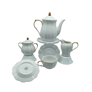 Grace Teaware White & Gold Scallop 11 pc Tea Set: 11pc porcelain Tea set in white with gold trim, scallop design. A classic, elegant set for 4. Very impressive on the table. What we love most about this classic beauty is that it can be used for any occassion, or holiday. This set includes 4 cups and saucers, cream and sugar bowl, 5 cup Teapot. Lovely for a ladies luncheon. Gifting Idea: Birthday, Bridal Shower, or Mother's Day. treat yourself or someone you love! Includes: 11 pc porcelain tea set by Grace Teaware 1- 5 cup Teapot 4 - cup/saucer set 1- cream/sugar set White background with gold trim. Dishwasher safe Grace Teaware White & Gold Scallop 11 pc Tea Set: 11pc porcelain Tea set in white with gold trim, scallop design. A classic, elegant set for 4. Very impressive on the table. What we love most about this classic beauty is that it can be used for any occassion, or holiday. This set includes 4 cups and saucers, cream and sugar bowl, 5 cup Teapot. Lovely for a ladies luncheon. Gifting Idea: Birthday, Bridal Shower, or Mother's Day. treat yourself or someone you love! Includes: 11 pc porcelain tea set by Grace Teaware 1- 5 cup Teapot 4 - cup/saucer set 1- cream/sugar set White background with gold trim. Dishwasher safe