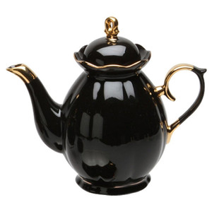 Grace Teaware Black & Gold Scallop 11 pc Tea Set: 11pc porcelain Tea set in black with gold trim, scallop design. A classic, elegant set for 4. Very impressive on the table. What we love most about this classic beauty is that it can be used for any occassion, or holiday.  This set includes 4 cups and saucers, cream and sugar bowl, 4 cup Teapot.  Lovely for a ladies luncheon.  Gifting Idea: Birthday, Bridal Shower, or Mother's Day.  treat yourself or someone you love!   Includes:  11 pc porcelain tea set by Grace Teaware 1- 4 cup Teapot 4 - cup/saucer set 1- cream/sugar set White background with gold trim.  Dishwasher safe