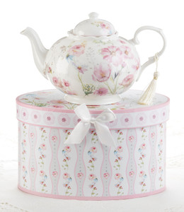 Poppysed Teapot 32 oz in gift box, will brighten anyone's day with this beautiful teapot gift in its own matching print gift box with matching satin ribbon. A decorative tassel on the handle adds a lovely finishing touch. Gifting Idea: birthday gift, bridal shower, get well, treat yourself or someone you love.   Includes:  9.5 x 5.6" Porcelain teapot, 4 cups (32 oz) Soft white background with pink poppy floral print Dishwasher safe