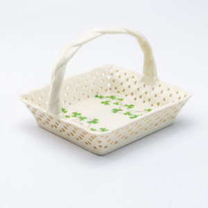 Clover Vine Teabag Holder Basket Porcelain: Fine porcelain basket with lacey cutout and a clover vine print to hold teabags, sugar packets or candy. Perfect for St. Patrick's Day. Includes: 1-Teabag Basket Complimentary Enclosure Card Clover Vine Teabag Holder Basket Porcelain: Fine porcelain basket with lacey cutout and a clover vine print to hold teabags, sugar packets or candy. Perfect for St. Patrick's Day. Includes: 1-Teabag Basket Complimentary Enclosure Card