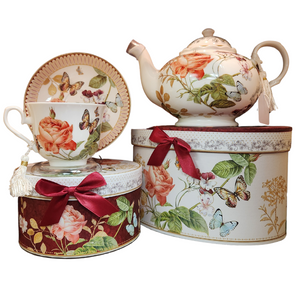 Winter Rose Garden will brighten anyone's day with this beautiful tea set in its own matching print gift box with matching satin ribbon. A decorative tassel on the handle adds a lovely finishing touch. Gifting Idea: birthday gift, bridal shower, get well, treat yourself or someone you love.   Includes:  9.5 x 5.6" Porcelain teapot, hold 4 cups (32 oz)  2 cup/saucer Soft white background with a burgundy and pink floral print Dishwasher safe