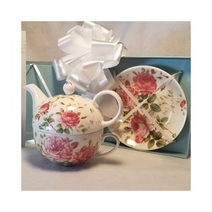 English Rose Teapot Duo is a nested Teapot, cup and saucer set comes in a beautiful pastel blue satin lined gift box. A lovely way to great the day with a moring cup of tea. This nested set allows a second cup ready to serve. A Bloggers favorite. This special gift comes with 2 oz of Cornucopia's Decaf French Vanilla Organic Loose Leaf Tea. Tea Notes: Decaf French Vanilla Organic (Loose Leaf) combines creamy carob with the essence of sweet vanilla and a robust base of decaffeinated black tea, Ingredients: Organic decaffeinated black tea, organic carob, natural flavor and organic stevi Taste: Full-bodied, smooth black tea brew, as rich as its caffeinated counterpart, creamy sweet with a hint of vanilla richness. Origin: decaffeinated teas go through a natural CO2 extraction process, also called effervescence. This process maintains tea flavor and antioxidant levels. Cornucopia's organic decaffeinated teas are sourced from the Putharjhora Tea Garden in Darjeeling, India. Includes: English Roses Teapot Duo, nested all in one Teapot, Teacup and Saucer with satin lined Gift Box, 2 oz of Decaf French Vanilla, Cornucopia's Organic Loose Leaf Tea Completed gift measures 6" long by 6" wide and 6" tall and weighs 2 pounds. This gift comes in a pastel blue satin lined box with a white bow. English Rose Teapot Duo is a nested Teapot, cup and saucer set comes in a beautiful pastel blue satin lined gift box. A lovely way to great the day with a moring cup of tea. This nested set allows a second cup ready to serve. A Bloggers favorite. This special gift comes with 2 oz of Cornucopia's Decaf French Vanilla Organic Loose Leaf Tea. Tea Notes: Decaf French Vanilla Organic (Loose Leaf) combines creamy carob with the essence of sweet vanilla and a robust base of decaffeinated black tea, Ingredients: Organic decaffeinated black tea, organic carob, natural flavor and organic stevi Taste: Full-bodied, smooth black tea brew, as rich as its caffeinated counterpart, creamy sweet with a hint of vanilla richness. Origin: decaffeinated teas go through a natural CO2 extraction process, also called effervescence. This process maintains tea flavor and antioxidant levels. Cornucopia's organic decaffeinated teas are sourced from the Putharjhora Tea Garden in Darjeeling, India. Includes: English Roses Teapot Duo, nested all in one Teapot, Teacup and Saucer with satin lined Gift Box, 2 oz of Decaf French Vanilla, Cornucopia's Organic Loose Leaf Tea Completed gift measures 6" long by 6" wide and 6" tall and weighs 2 pounds. This gift comes in a pastel blue satin lined box with a white bow.