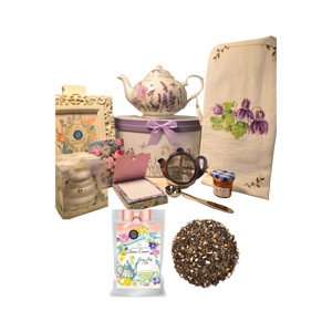 There's Always Time for Tea- Gift Box-Lavender Rose: Kick your heels off and enjoy teatime with this lovely gift set. Comes with porcelain teapot in matching print gift box, Cornucopia's Loose-Leaf tea, tea accessories and stationery. Sip your tea, make notes on the note pad, and rejuvenate to meet the rest of the day. Our high-grade tea will leave you feeling refreshed and ready to meet any challenges ahead. Includes: • 5 x 5.6" Porcelain Lavender Rose teapot in its own matching print gift box with matching satin ribbon. A decorative tassel on the handle adds a lovely finishing touch. Soft white background with a Blue Butterfly and pastel floral print. Dishwasher safe. • 1 oz of Cornucopia Loose-Leaf Black Tea -Lemon Essence with Peel o Cornucopia Teas come in resealable pouches with decorative tea labels as shown in the image, along with a recipe and brewing guide. • Soft 100% cotton large white flour sack tea towel with coordinating print • Cha Cult Tea Filter Lid included Medium (Germany) • Honey Pot with Dipper • 1 oz Bonne Maman honey, • 1- loose leaf measuring spoon with engraved wording on the handle " A cup of perfect tea", • Embossed purse pad 3 inches x 4 inches and has 100 coordinating patterned pages and a magnetic closure. Other Items Available: • Matching cup and saucer available D8101-7. sold separately. Additional pieces, teas and Tea ware are shipped together, Gifting Idea: birthday gift, bridal shower, get well, treat yourself or someone you love. If purchasing as a gift your personal message is included on the pamphlet and placed inside the shipping box. There's Always Time for Tea- Gift Box-Lavender Rose: Kick your heels off and enjoy teatime with this lovely gift set. Comes with porcelain teapot in matching print gift box, Cornucopia's Loose-Leaf tea, tea accessories and stationery. Sip your tea, make notes on the note pad, and rejuvenate to meet the rest of the day. Our high-grade tea will leave you feeling refreshed and ready to meet any challenges ahead. Includes: • 5 x 5.6" Porcelain Lavender Rose teapot in its own matching print gift box with matching satin ribbon. A decorative tassel on the handle adds a lovely finishing touch. Soft white background with a Blue Butterfly and pastel floral print. Dishwasher safe. • 1 oz of Cornucopia Loose-Leaf Black Tea -Lemon Essence with Peel o Cornucopia Teas come in resealable pouches with decorative tea labels as shown in the image, along with a recipe and brewing guide. • Soft 100% cotton large white flour sack tea towel with coordinating print • Cha Cult Tea Filter Lid included Medium (Germany) • Honey Pot with Dipper • 1 oz Bonne Maman honey, • 1- loose leaf measuring spoon with engraved wording on the handle " A cup of perfect tea", • Embossed purse pad 3 inches x 4 inches and has 100 coordinating patterned pages and a magnetic closure. Other Items Available: • Matching cup and saucer available D8101-7. sold separately. Additional pieces, teas and Tea ware are shipped together, Gifting Idea: birthday gift, bridal shower, get well, treat yourself or someone you love. If purchasing as a gift your personal message is included on the pamphlet and placed inside the shipping box.